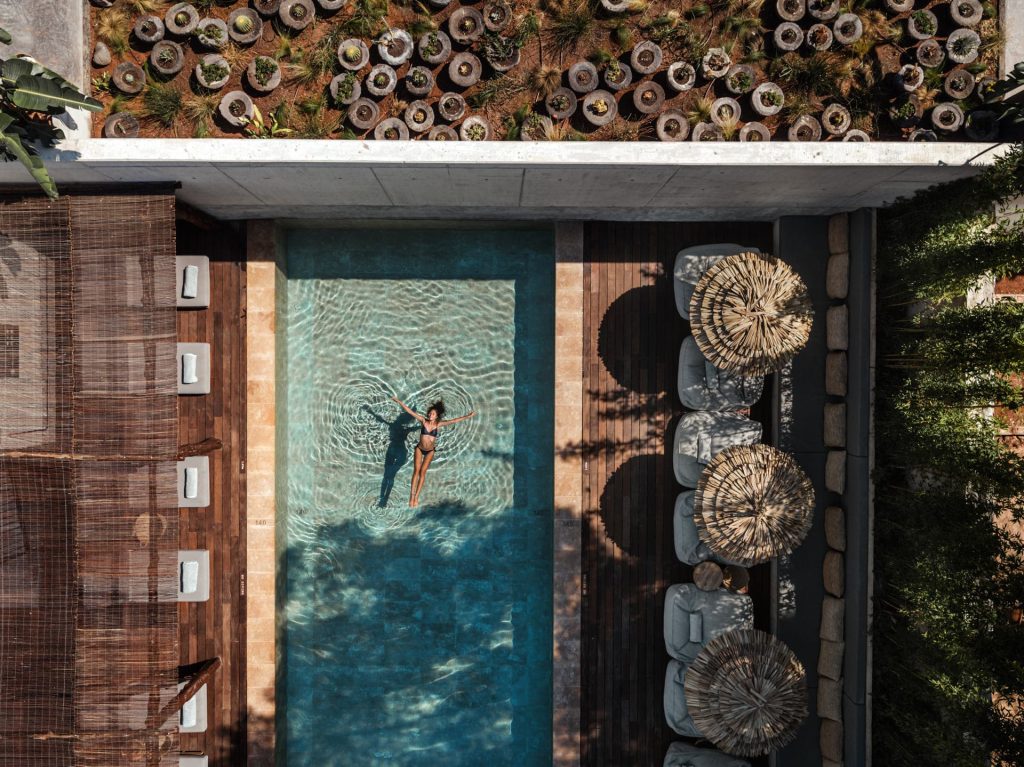 girl in the pool in oku hotel ibiza